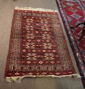 Good quality Bokhara carpet decorated predominantly in cream, red and brown with geometric repeating