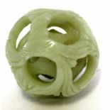 Jadeite type puzzle ball with reticulation and an interior ball, the exterior modelled as a