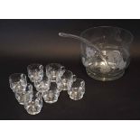 Large glass punch bowl with glass serving scoop and nine small punch glasses, all with loop