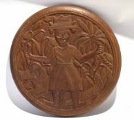 Mid 20th Century Nigerian Benin style carved circular table top with later wall mountings.