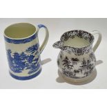 Large Pearlware cylindrical mug with a blue and white design, together with a further jug with a