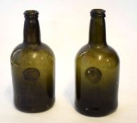 Pair of early 19th century bottles both with the seal for Sir Will Strickland, date 1809, 26cm high