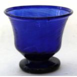 Early 19th century wrythen shaped bowl on shallow foot in blue glass, possibly North East of