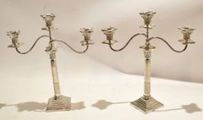 Pair of silver plated two-branch candelabra with Corinthian column supports, 50cm high