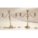 Pair of silver plated two-branch candelabra with Corinthian column supports, 50cm high