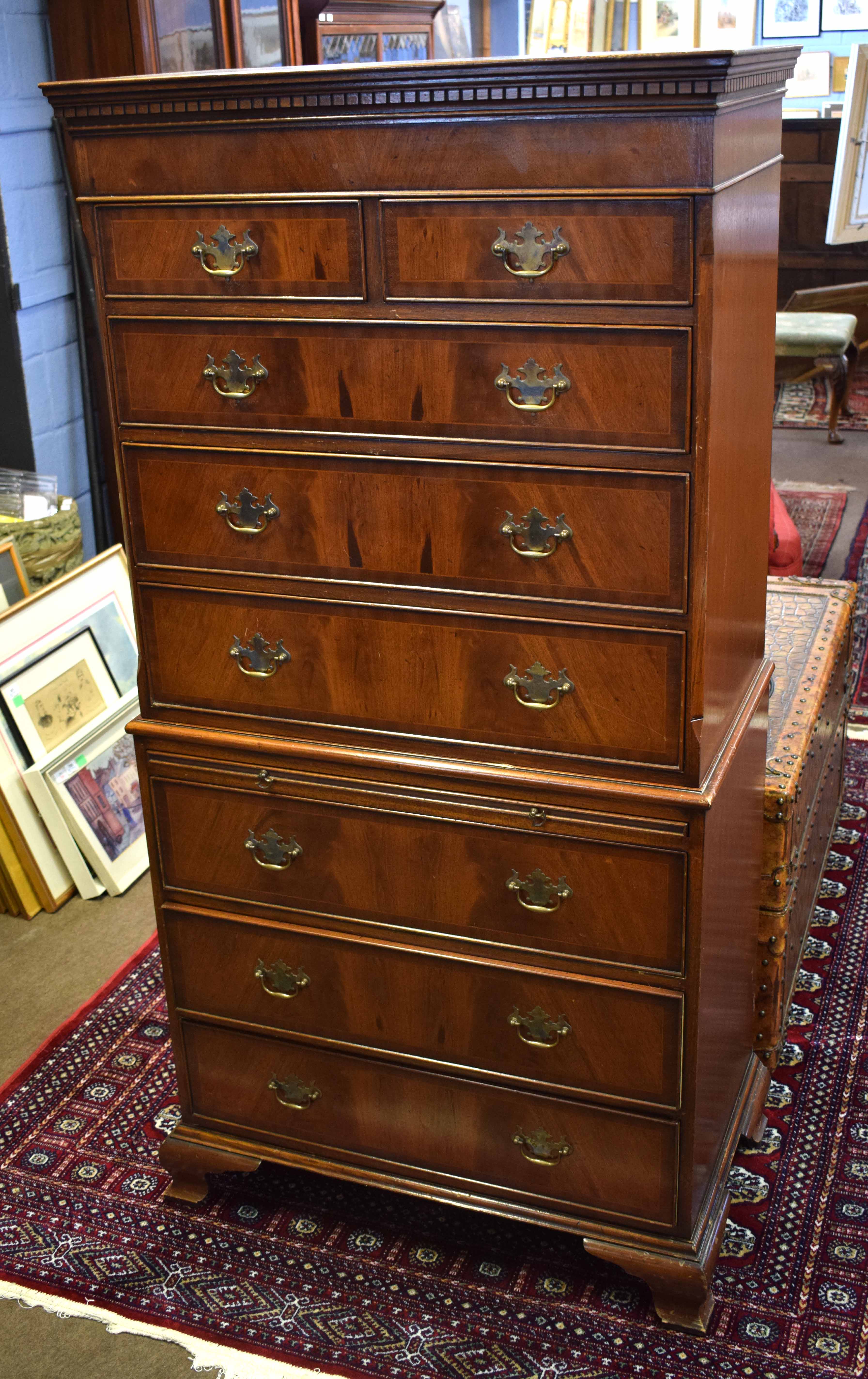 Reproduction mahogany chest on chest, the upper section with two short and three full width drawers,