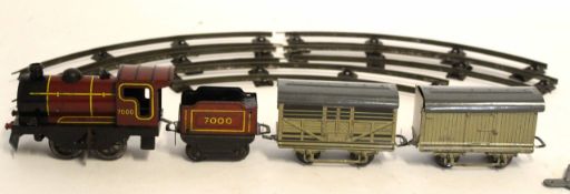 Boxed Brimtoy tin plate 0 gauge train set comprising train, tender, two goods vans and track, size