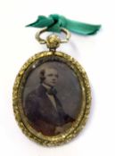 Pinchbeck framed small daguerrotype pendant of a young man, 3 x 2cm