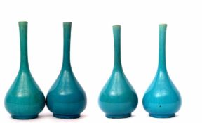 Group of four turquoise glazed tear drop shape vases, the earthenware bodies with turquoise glaze,