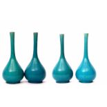 Group of four turquoise glazed tear drop shape vases, the earthenware bodies with turquoise glaze,