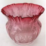 Late 19th century cranberry glass oil lamp shade with a floral design and crimped rim