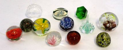 Assortment of ten modern glass paperweights, decorated in various colours (11)