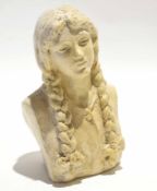 Resin bust of a young girl with braided hair and ribbons, signed to reverse E. Halsey, 19cm tall