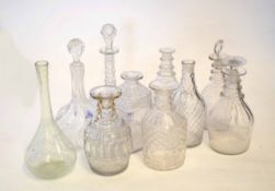 Group of ten cut glass decanters, some lacking stoppers, with typical cut glass designs, one with