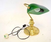 Victorian style brass effect desk lamp with green adjustable shade on a circular base, 35cm tall x