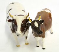 Group of Beswick cattle, the bull entitled Champion White Hill Mancate, the cow marked Champion