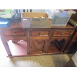 EASTERN HARDWOOD DRESSER BASE WITH THREE DRAWERS WITH CENTRAL CUPBOARD DOOR WITH OPEN SHELVES AND