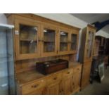 GOOD QUALITY WAXED PINE DRESSER, THE TOP FITTED WITH FOUR GLAZED DOORS, THE BASE WITH FOUR DRAWERS