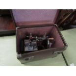 BROWN REXINE CASED CHILD'S SEWING MACHINE