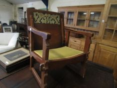 ARTS & CRAFTS TYPE METAMORPHIC TABLE/ARMCHAIR WITH CARVED BACK AND YELLOW UPHOLSTERY