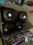 BOX OF FOUR LIGNUM VITAE CARPET BOWLS