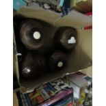 BOX OF FOUR LIGNUM VITAE CARPET BOWLS