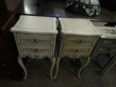 PAIR OF WHITE PAINTED TWO DRAWER BEDSIDE TABLES WITH CARVED DRAWER FRONTS ON CABRIOLE LEGS (2)