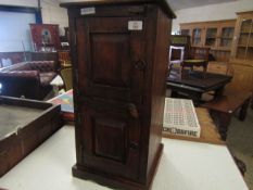 EASTERN HARDWOOD SMALL TWO DOOR CUPBOARD WITH RINGLET HANDLES