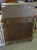 MID-20TH CENTURY OAK FRAMED BUREAU WITH DROP FRONT AND SINGLE FULL WIDTH DRAWER OVER TWO DOORS