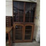 PINE FRAMED BOOKCASE CABINET WITH TWO GLAZED SECTIONAL DOORS AND TWO FITTED SHELVES TO TOP WITH