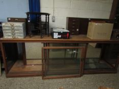 VINTAGE PINE SHOP COUNTER WITH TWO GLASS SLIDING DOORS, MIRRORED BACK AND FITTED GLASS SHELVES