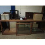 VINTAGE PINE SHOP COUNTER WITH TWO GLASS SLIDING DOORS, MIRRORED BACK AND FITTED GLASS SHELVES