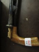 SILVER AND IVORY TOPPED EBONISED WALKING CAIN TOGETHER WITH A FURTHER WALKING STICK