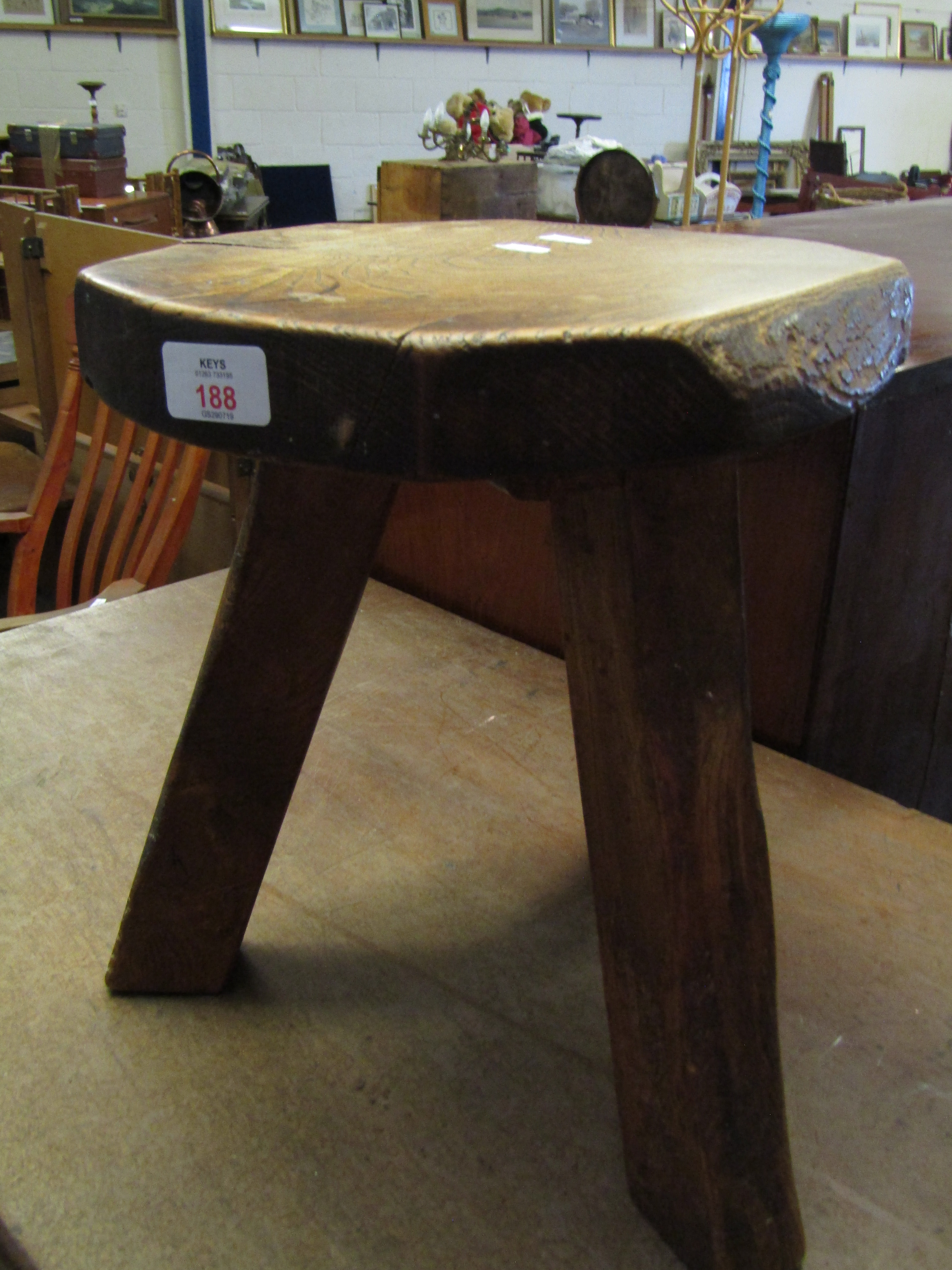 ELM TOPPED RUSTIC THREE FOOTED STOOL