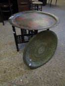 FOLDING BIARNAISE TYPE TABLE TOGETHER WITH AN ETCHED BRASS TRAY AND ONE OTHER (3)