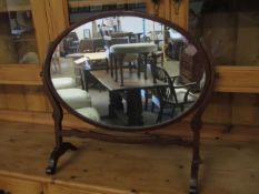 MAHOGANY FRAMED OVAL DRESSING TABLE MIRROR WITH SHAPED SUPPORTS