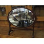 MAHOGANY FRAMED OVAL DRESSING TABLE MIRROR WITH SHAPED SUPPORTS