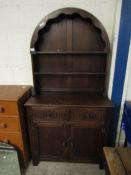 EARLY 20TH CENTURY OAK DRESSER WITH ARCHED TOP AND TWO FIXED SHELVES WITH TWO DRAWERS OVER TWO