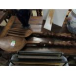PAIR OF EASTERN SOFTWOOD OVER-SIZED SPOON AND FORK WITH CARVED FIGURAL HANDLES, 97CM LONG