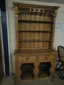 RUSTIC WAXED PINE KITCHEN DRESSER, THE TOP FITTED WITH THREE FIXED SHELVES WITH FRETWORK CARVED TOP,