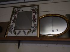 DECORATIVE GILT FRAMED MIRROR WITH A FLORAL BORDER TOGETHER WITH AN OVAL WALL MIRROR (2)