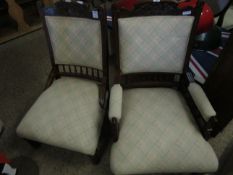 EDWARDIAN WALNUT HIS AND HERS ARMCHAIRS WITH CARVED TOP RAIL AND SPINDLE BACKS