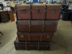 FOUR BROWN REXINE AND BEECHWOOD BANDED TRUNKS