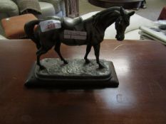 PEWTER MODEL OF A RACEHORSE ON A WOODEN PLINTH