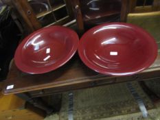 TWO RED GLAZED SHALLOW PEDESTAL BOWLS