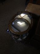 THREE OVAL RESIN WALL MIRRORS, ONE WITH RIBBON TOP TOGETHER WITH A FURTHER CONVEX MIRROR WITH BUTTON