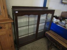 MAHOGANY FRAMED TWO GLAZED DOOR BOOKCASE RAISED ON PAD FEET