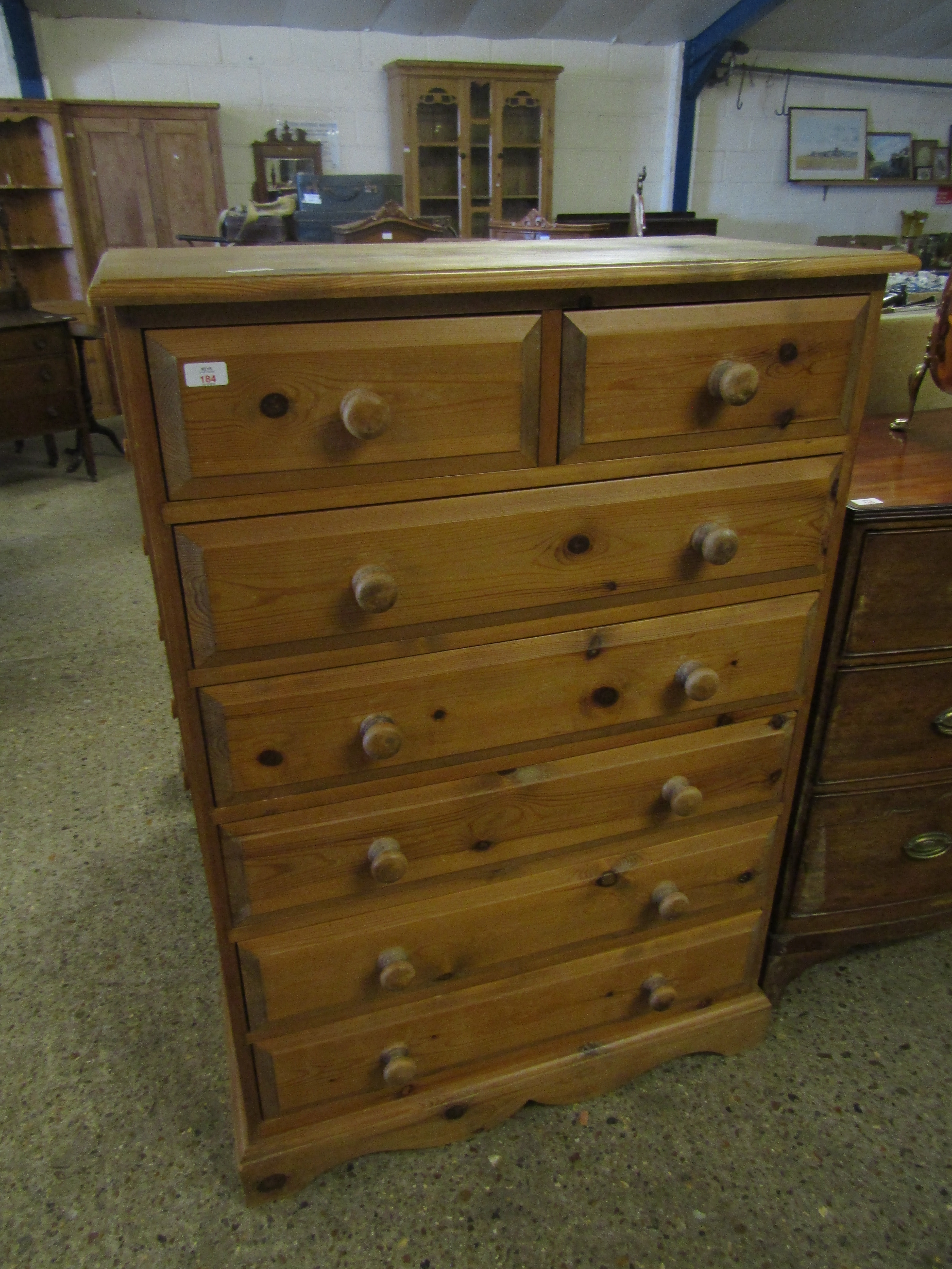 WAXED PINE TWO OVER FIVE FULL WIDTH DRAWER CHEST WITH TURNED KNOB HANDLES