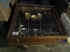 TEAK CASED BRASS SET OF CUTLERY