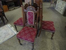 SET OF FOUR EDWARDIAN WALNUT CARVED DINING CHAIRS WITH RED FLORAL INLAID SEAT AND BACK, ON TURNED